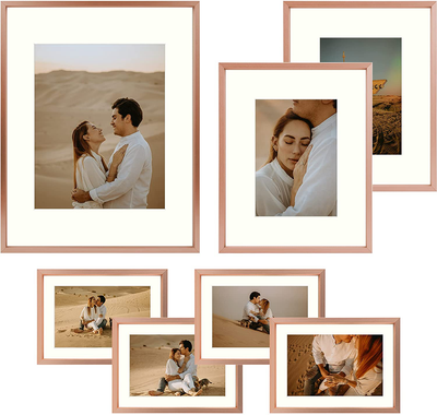 Frametory, Aluminum Picture Frames Set of 7 - Rose Gold Gallery Wall Kit - Displays One 11x14, Two 8x10, and Four 5x7 inch Photos for Home Decoration