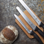 Mercer Culinary Millennia Bread Knife, 10-Inch Wide Wavy Edge, White
