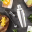 Cocktail Shaker Set by Cresimo - Stainless Steel Bartending Kit with 24 Ounce Cocktail Shaker with Built in Drink Strainer, Measuring Jigger, Mixing Spoon & Drink Recipe Guide - Professional Bar Tools